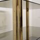 Hollywood Regency gilt metal and smoked glass shelf, Italy circa 1970