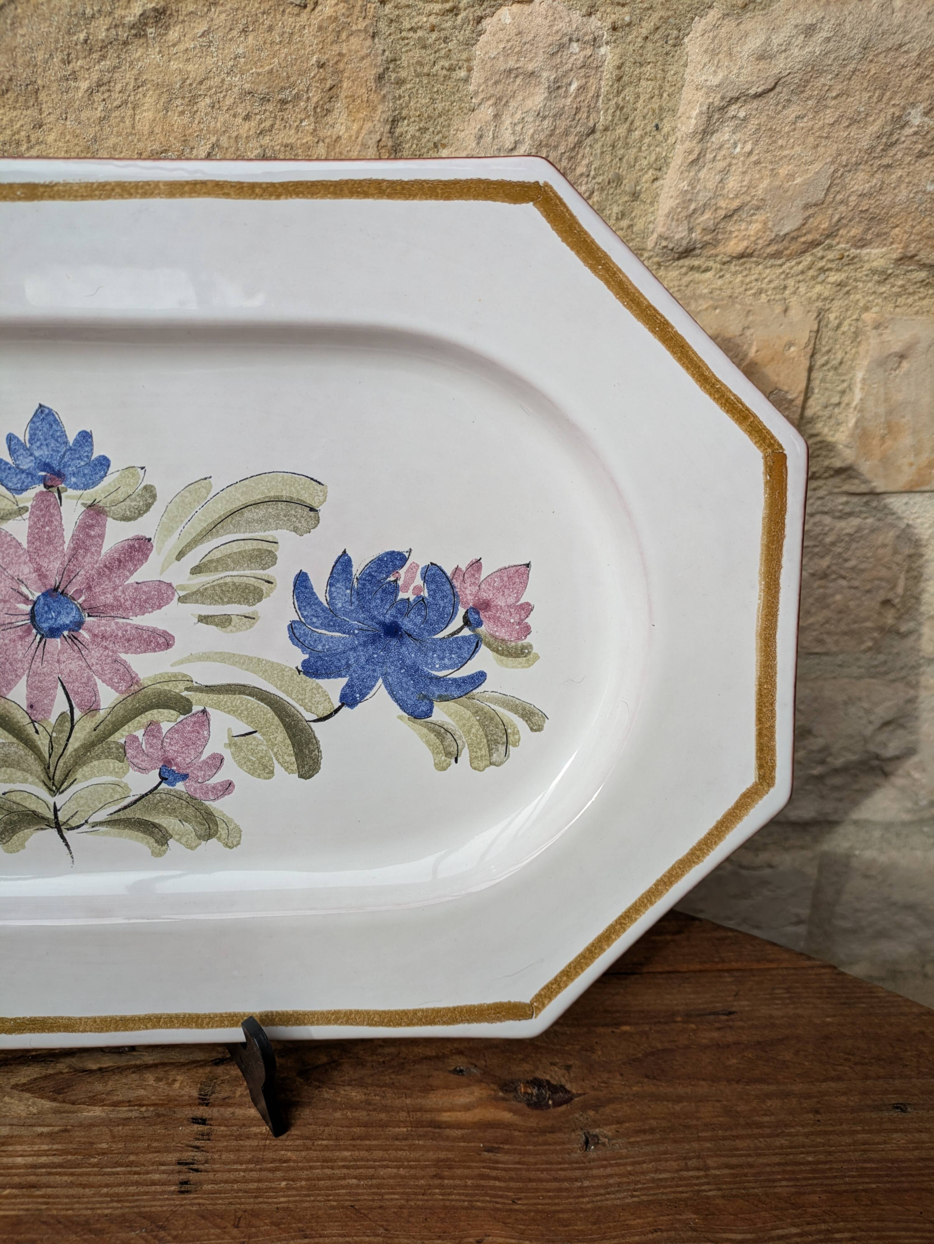 Rectangular earthenware dish with a glazed finish, decorated with a bouquet of flowers.