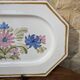 Rectangular earthenware dish with a glazed finish, decorated with a bouquet of flowers.