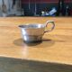 small silver-plated metal cup