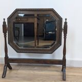 Antique beveled octagonal vanity mirror in carved wood