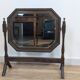 Antique beveled octagonal vanity mirror in carved wood