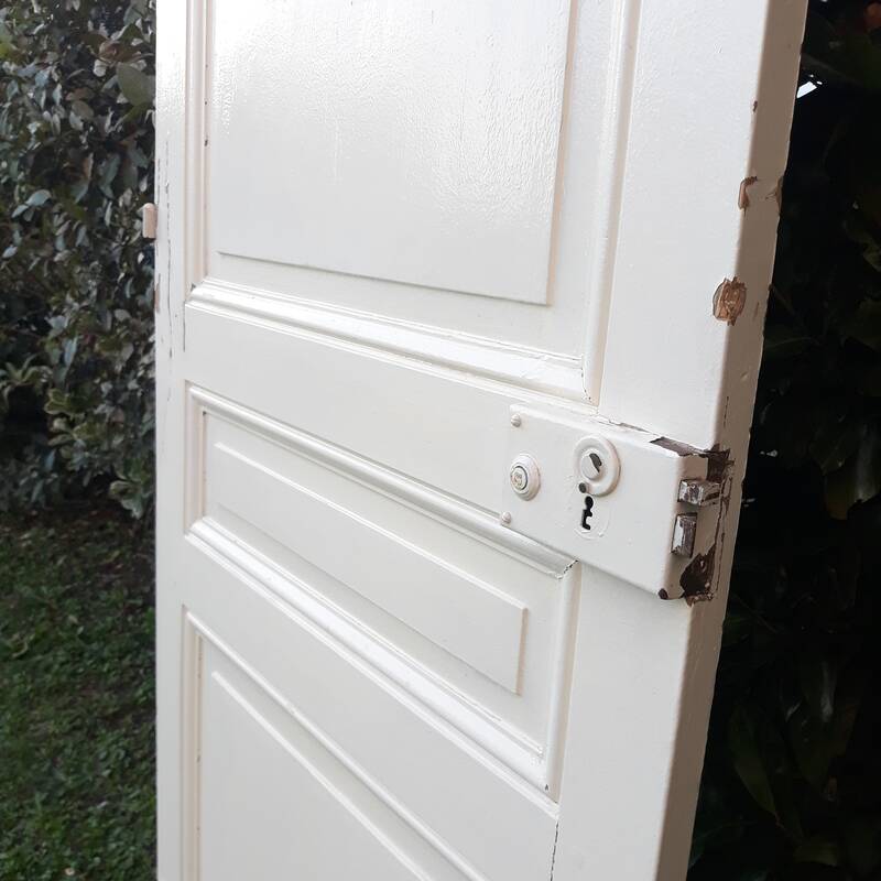 Communication door H220xW80.5cm, old panelled with moulding.
