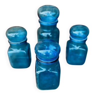 Set of 4 vintage blue glass jars.