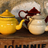 Trio of small enamelled teapots