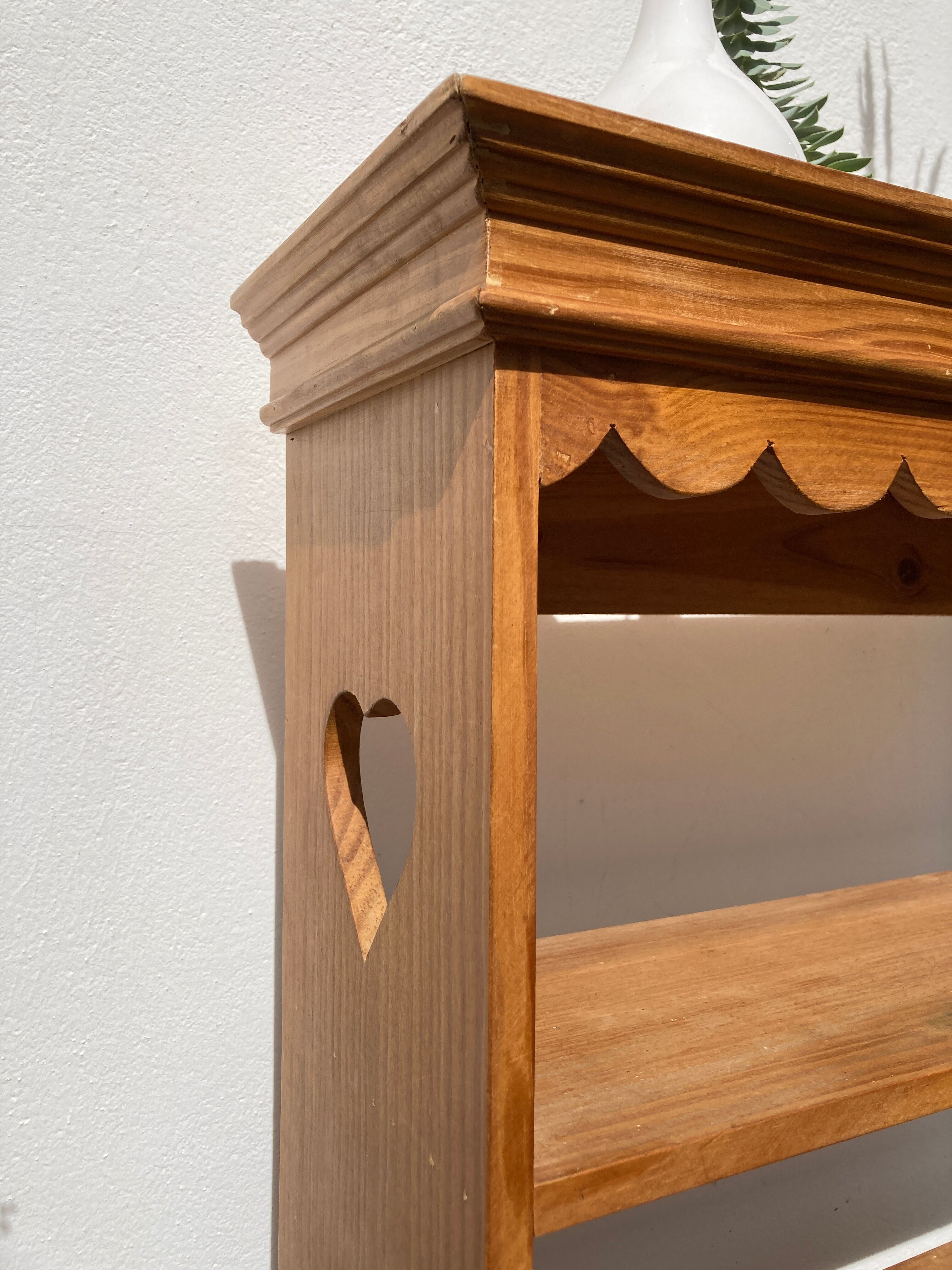 Wall shelf in raw wood with drawers and openwork hearts