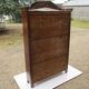 Small solid wooden cabinet with a gendarme hat