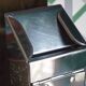 Vintage wall ashtray in shiny metal industrial style