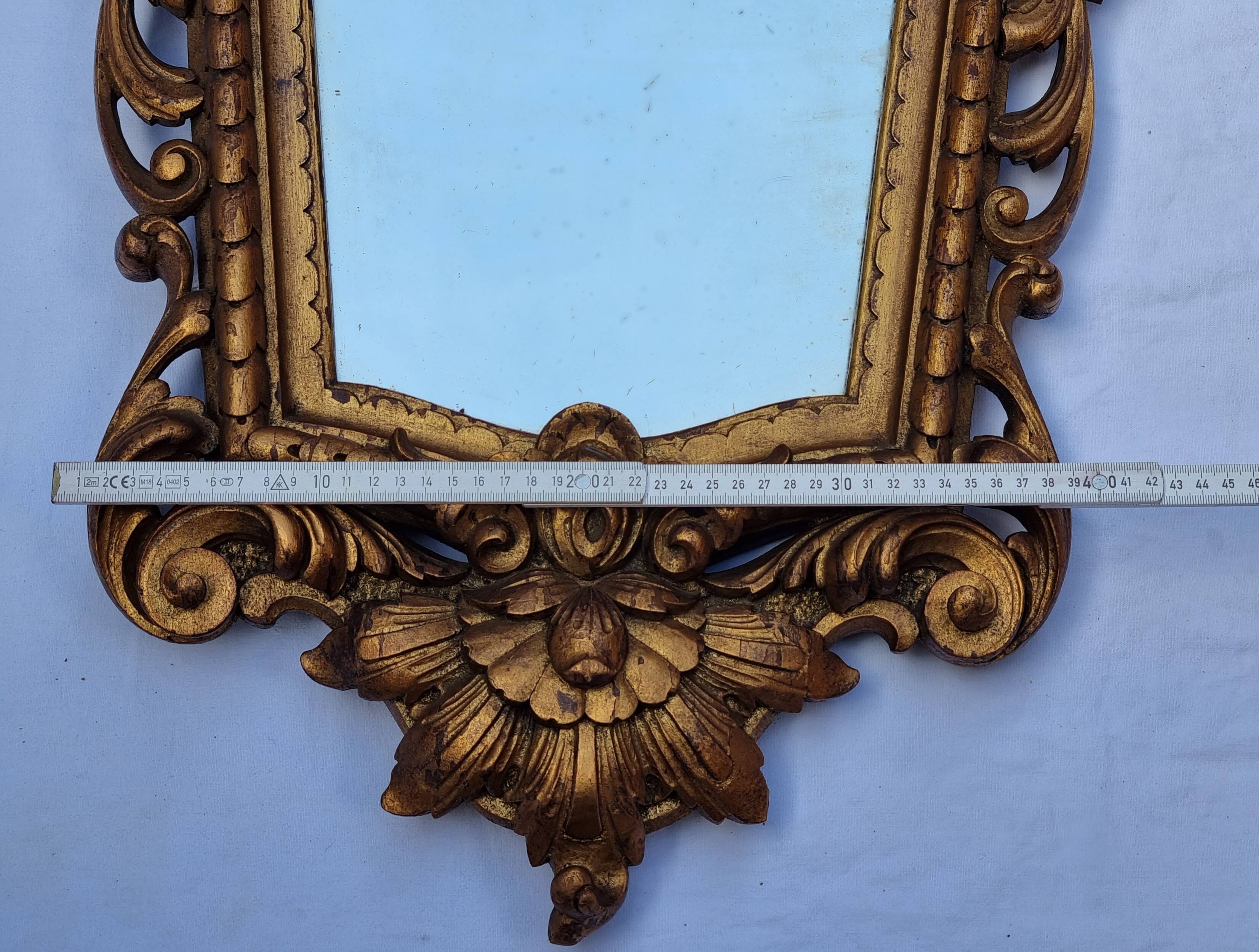 Antique wall mirror in carved gilded wood, Louis XV style, 19th century, 98 x 57 cm.