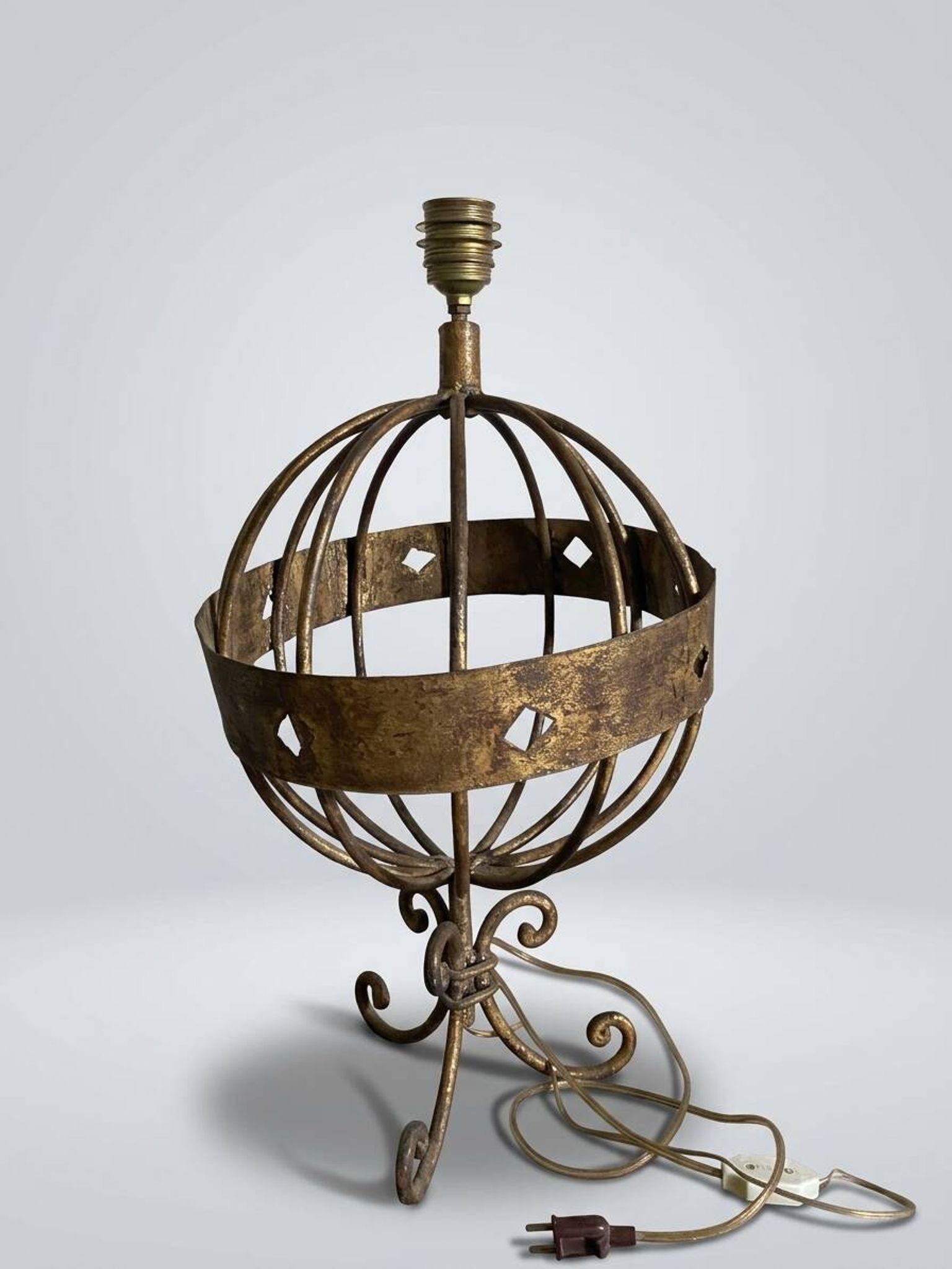 Vintage table lamp in the shape of an armillary sphere.