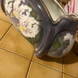 Northern hamage planter in purple color, gold edging and decorated with stenciled white lily flowers.