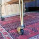 Vintage 1960s rolling dessert trolley in gold metal and formica.