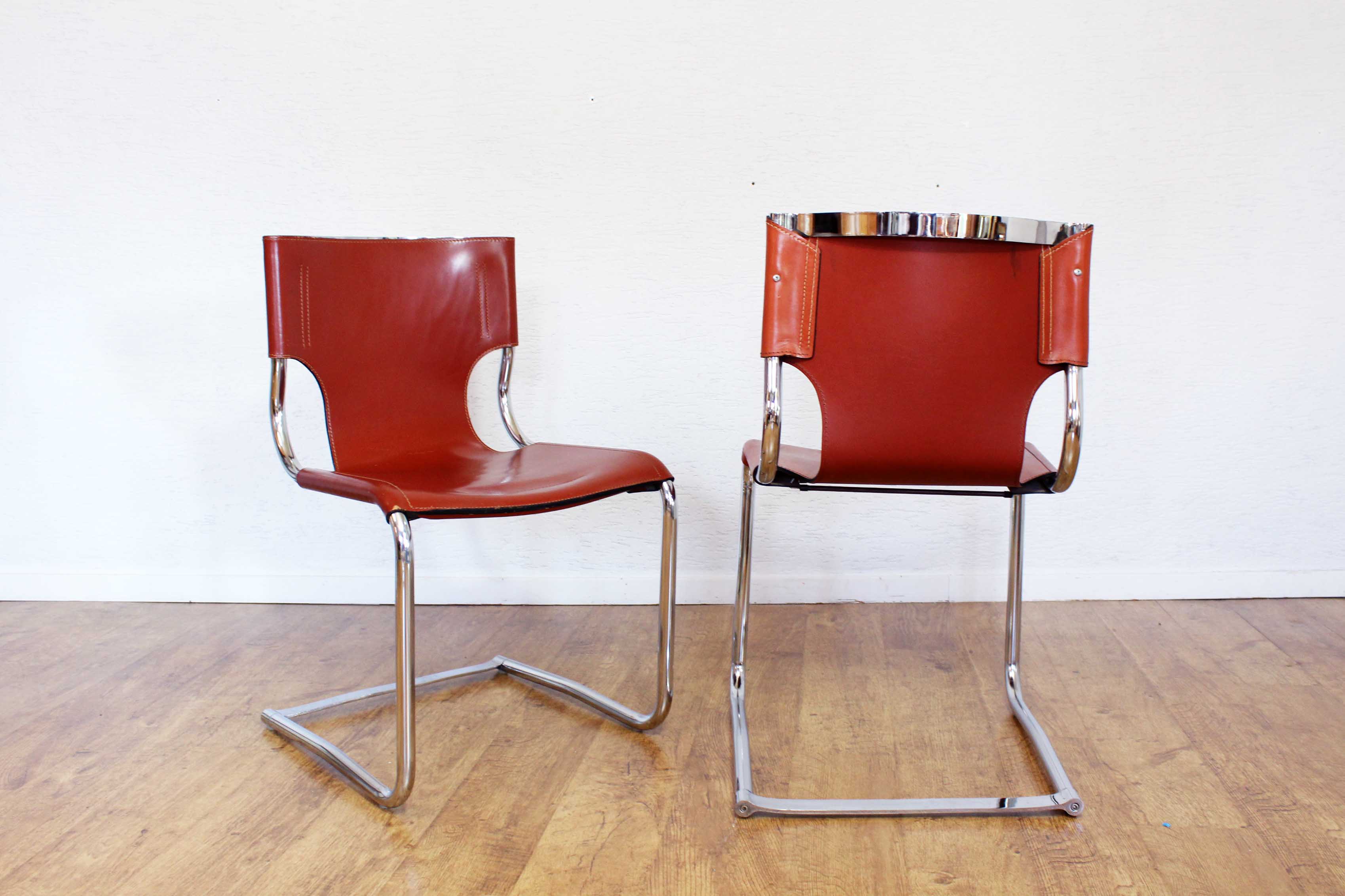 Pair of chairs in leather and chrome tube