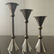 Trio of vintage metal and bronze candle holders