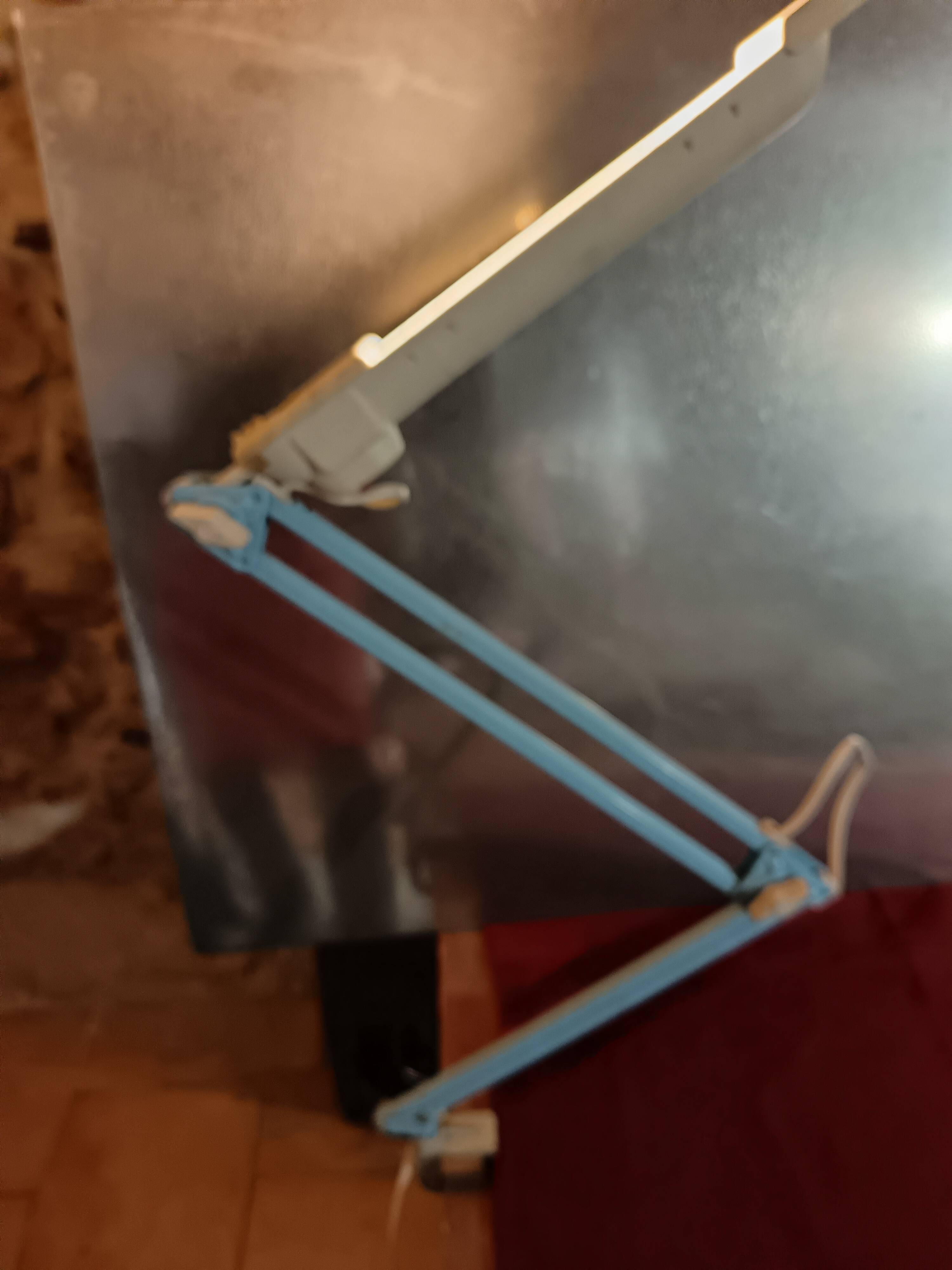 Articulated blue desk lamp