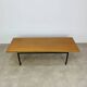 1950s modernist coffee table, wood and black metal.