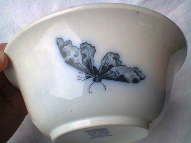 Ramekin in earthenware with decoration of flowers, butterflies and birds