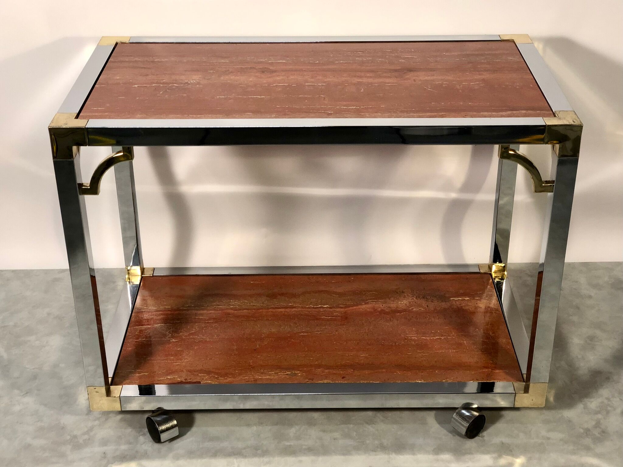 Italian rolling dessert table with two trays decorated with pink travertine