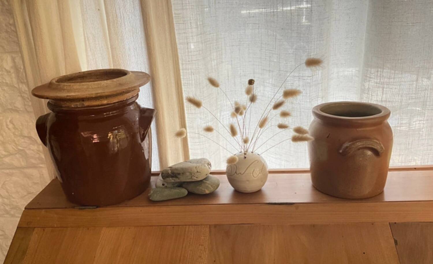 Ancient ceramic salt cellar and its lid.