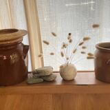 Ancient ceramic salt cellar and its lid.