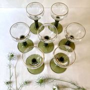 7 Alsace Roemer wine glasses, moss green stepped bases and gold trim.