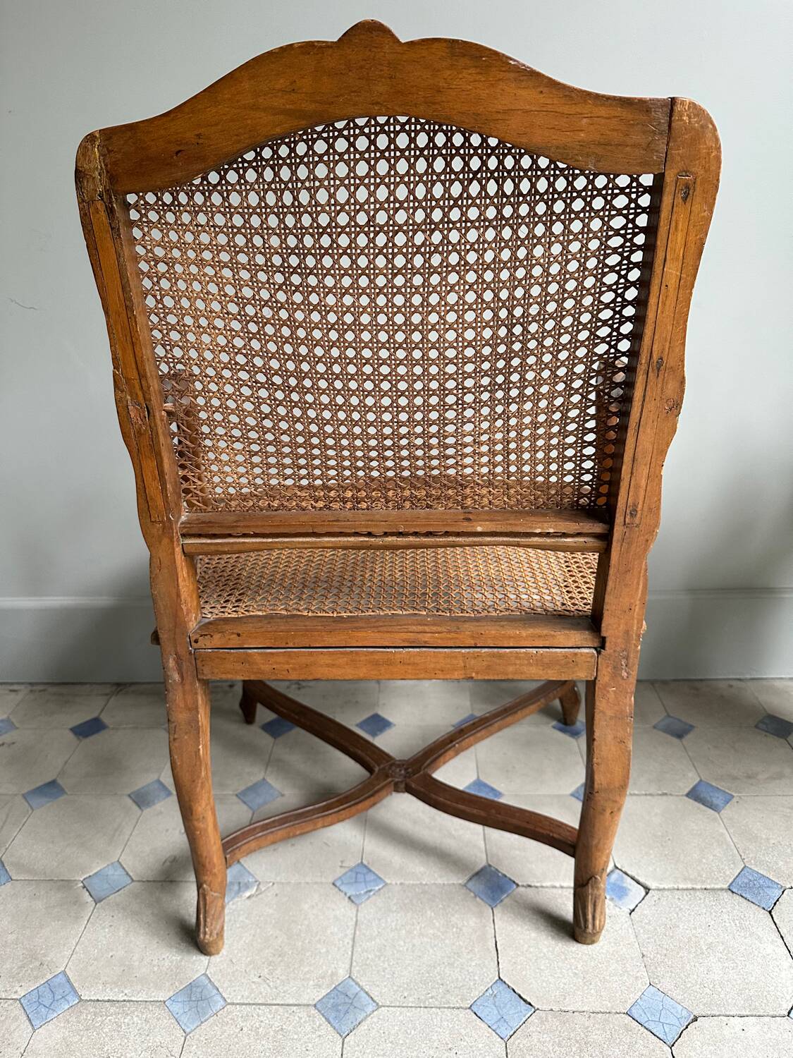 Regency armchair with stretcher