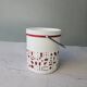 Vintage white opaline ice bucket with red patterns.