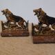 Small roaring lion bookends in patinated metal on a marble base.