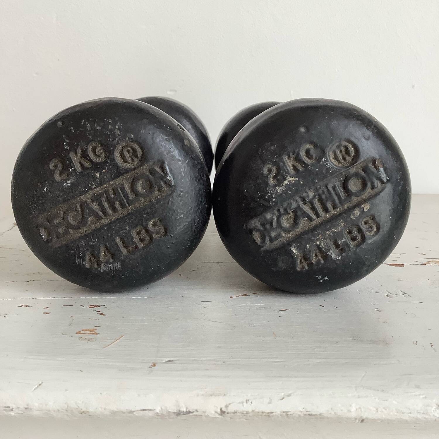 Pair of wooden and cast iron dumbbells