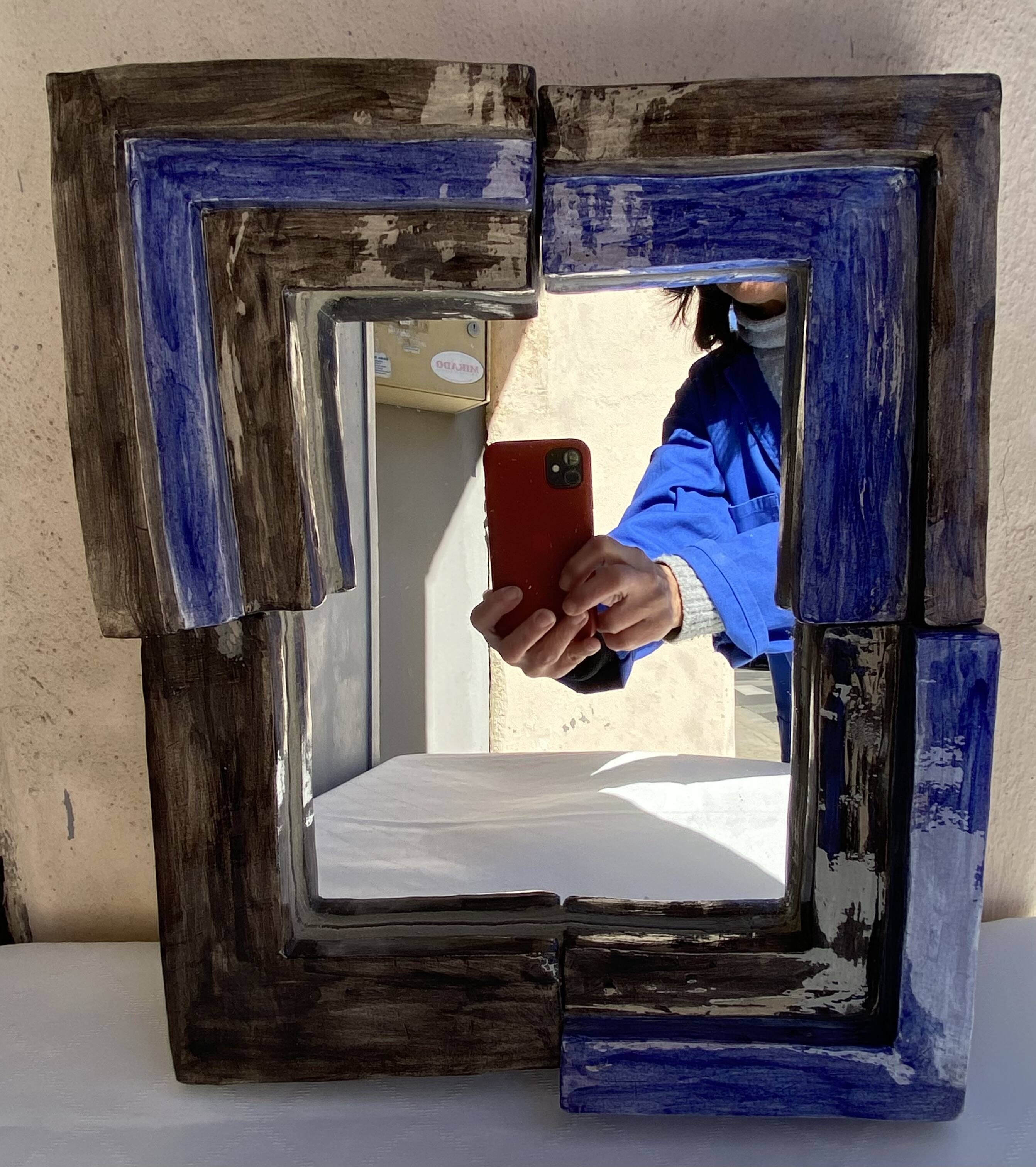 Mirror with ceramic frame