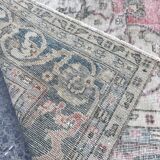 Pale pink rug with medallion
