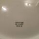 Limoges porcelain plate with a blue speckled rim.