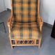 Vintage armchair in bamboo and rattan with a tartan pattern.