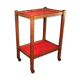 Serving in varnished chestnut and red leather