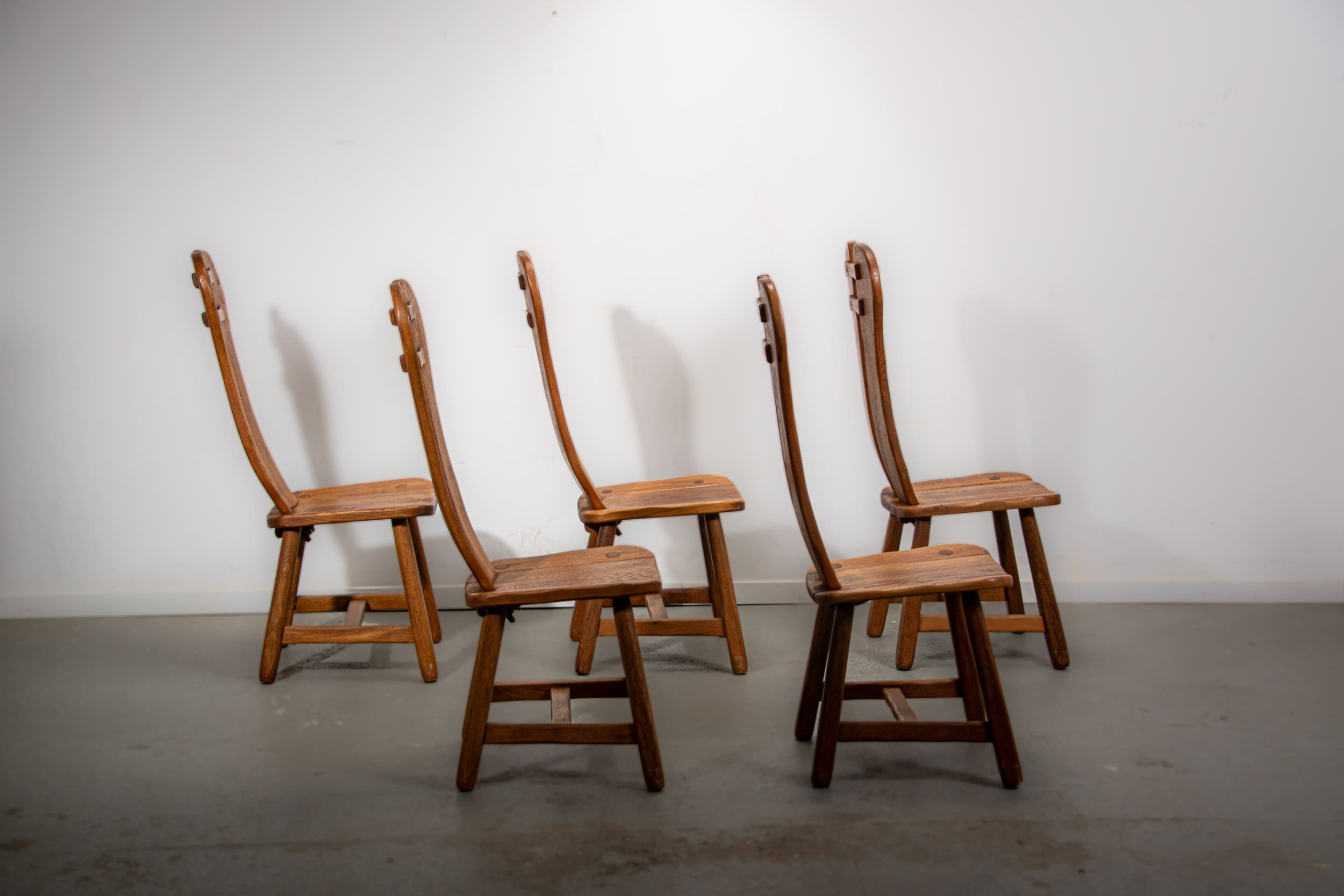 De Puydt brutalist dining chairs in solid oak. Circa 1970.