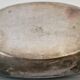 I037 Large shallow antique silver-plated dish in the Louis XVI style with bead decoration.