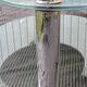 Coffee table with rotating glass tops by Antoine Motard.