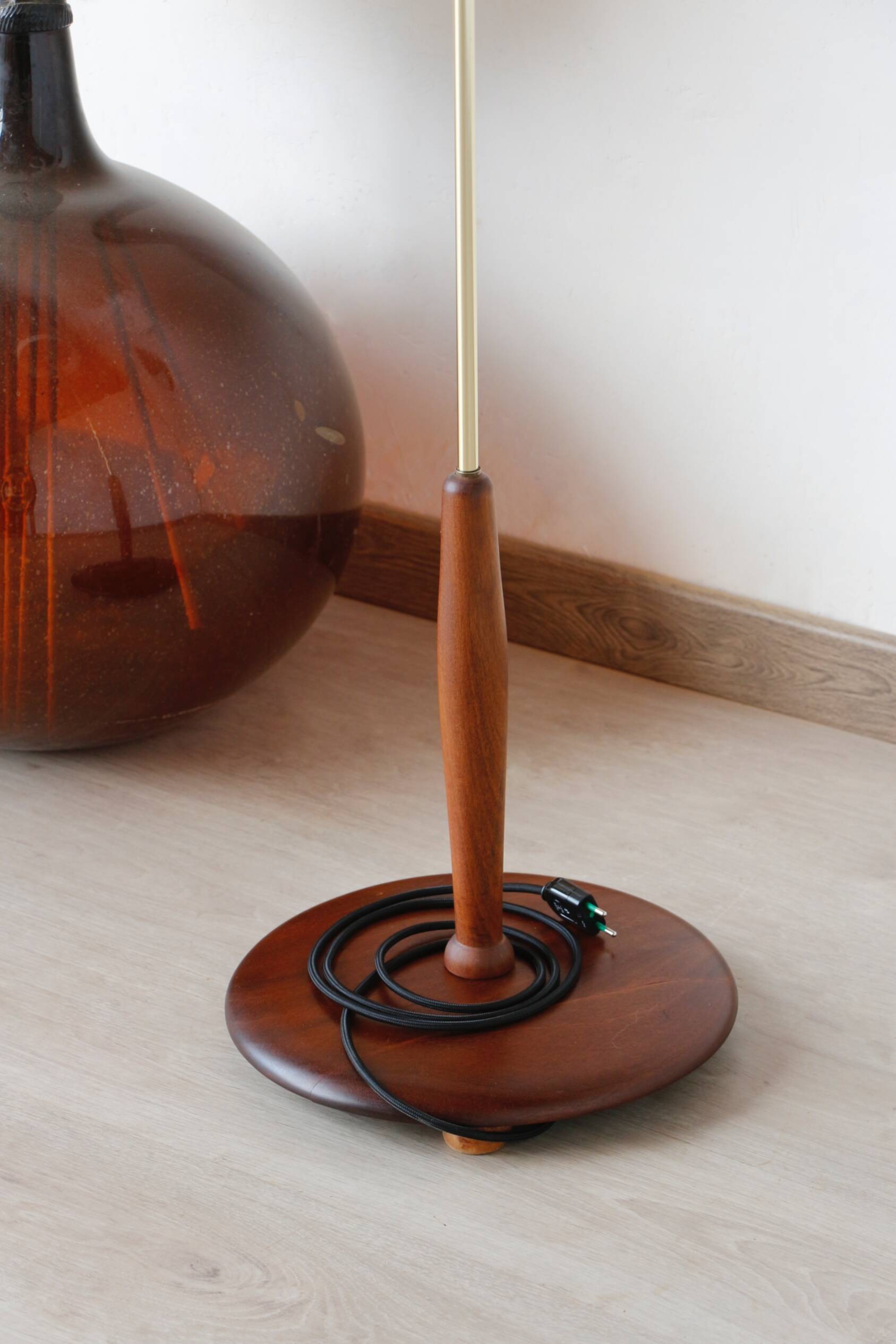 Vintage floor lamp in teak and brass with a cream shade.