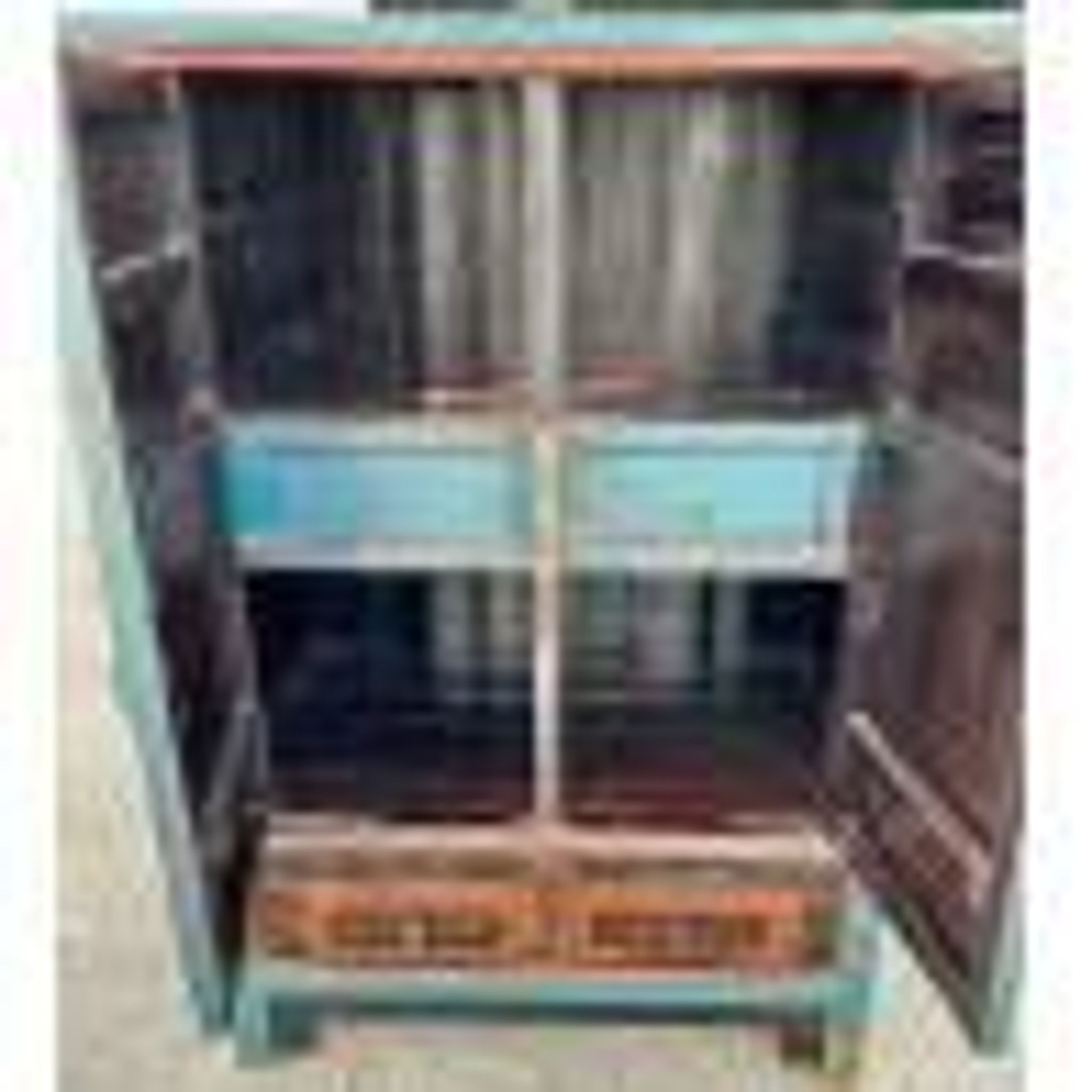 Restored antique Vietnamese wardrobe with care.