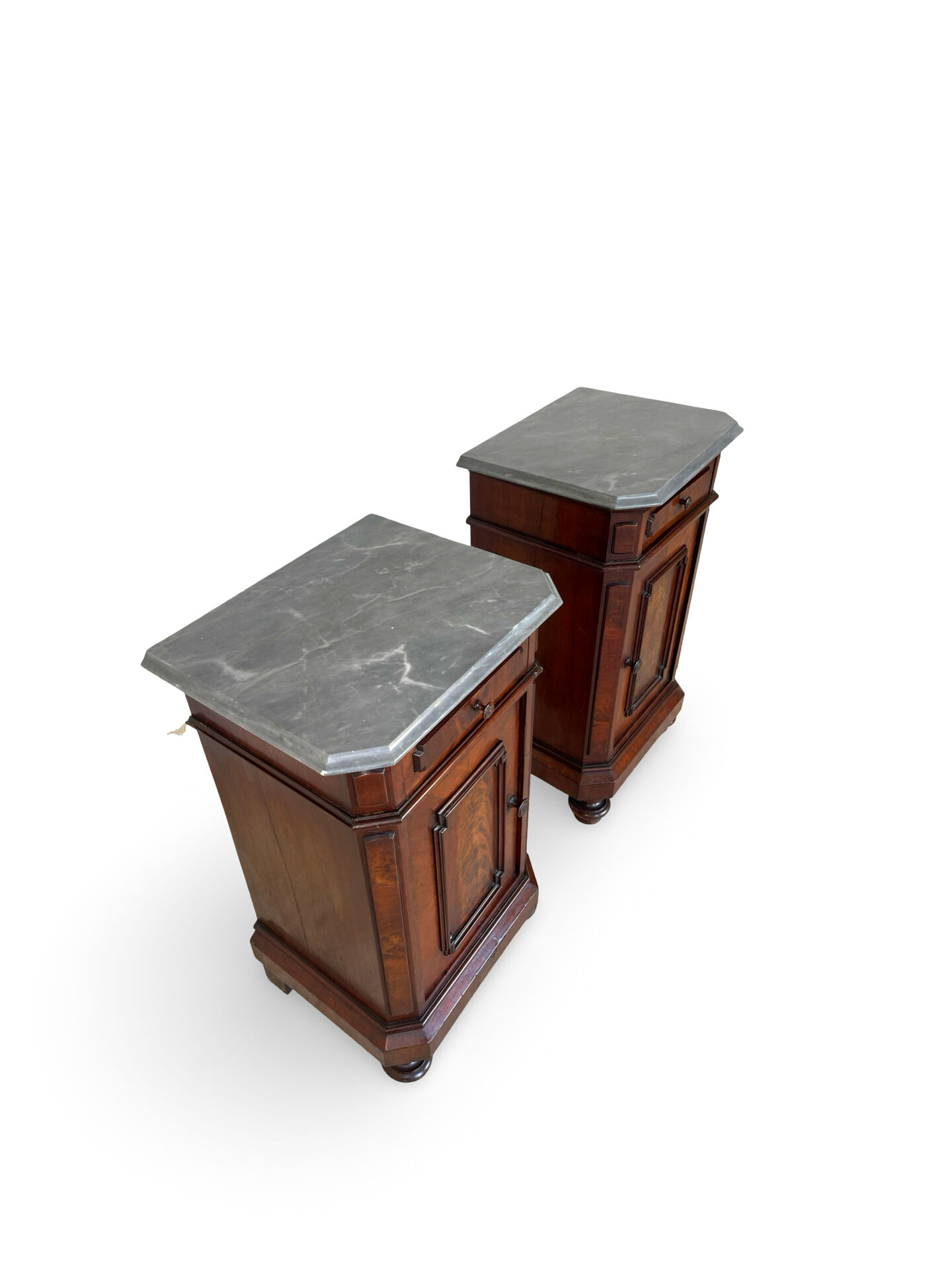 A pair of antique walnut bedside tables from the 1890s.