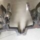 Pair of bronze fireplace firedogs with fleur-de-lys decor, art deco