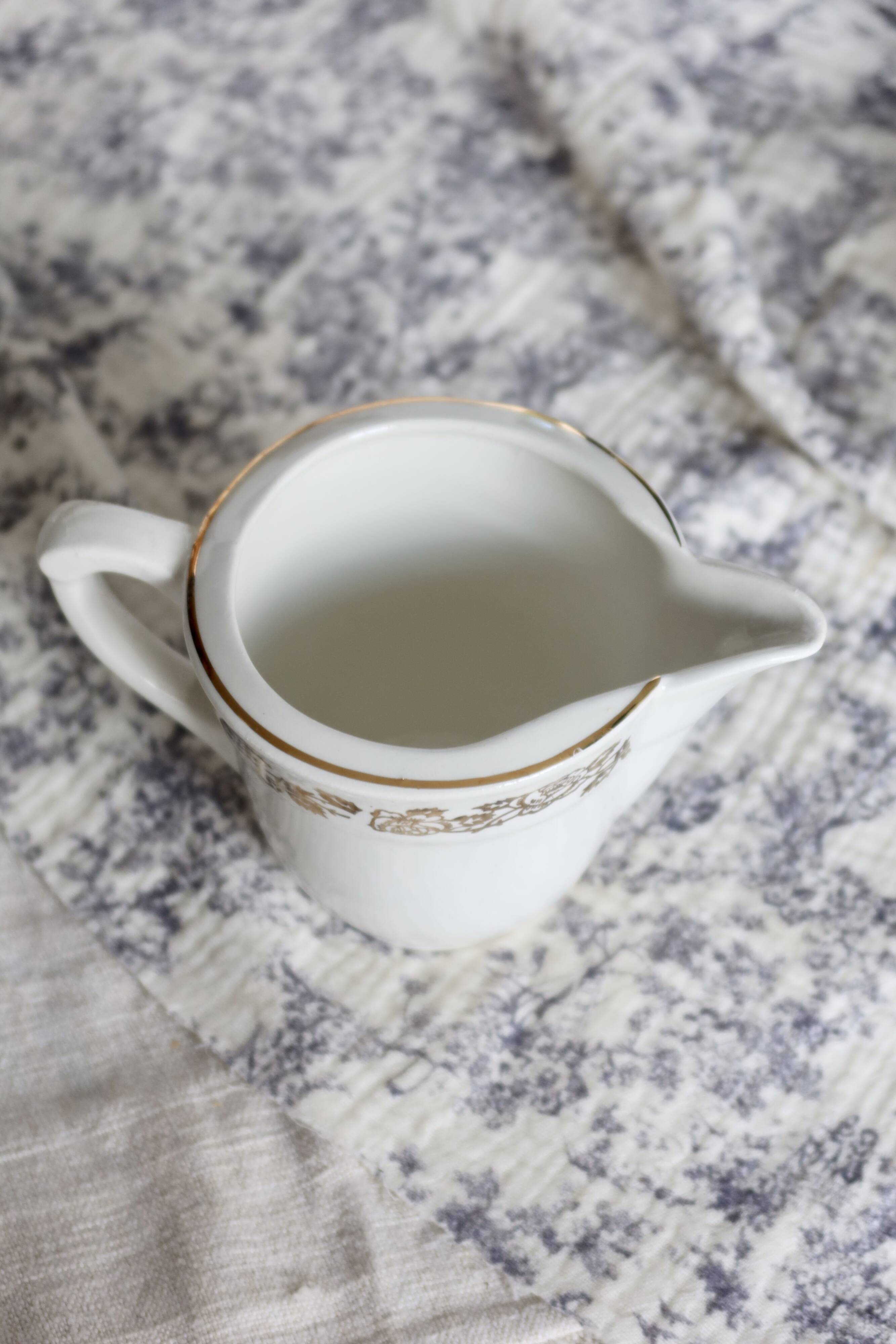 Vintage earthenware milk jug from Moulin des Loups – Gold floral motif