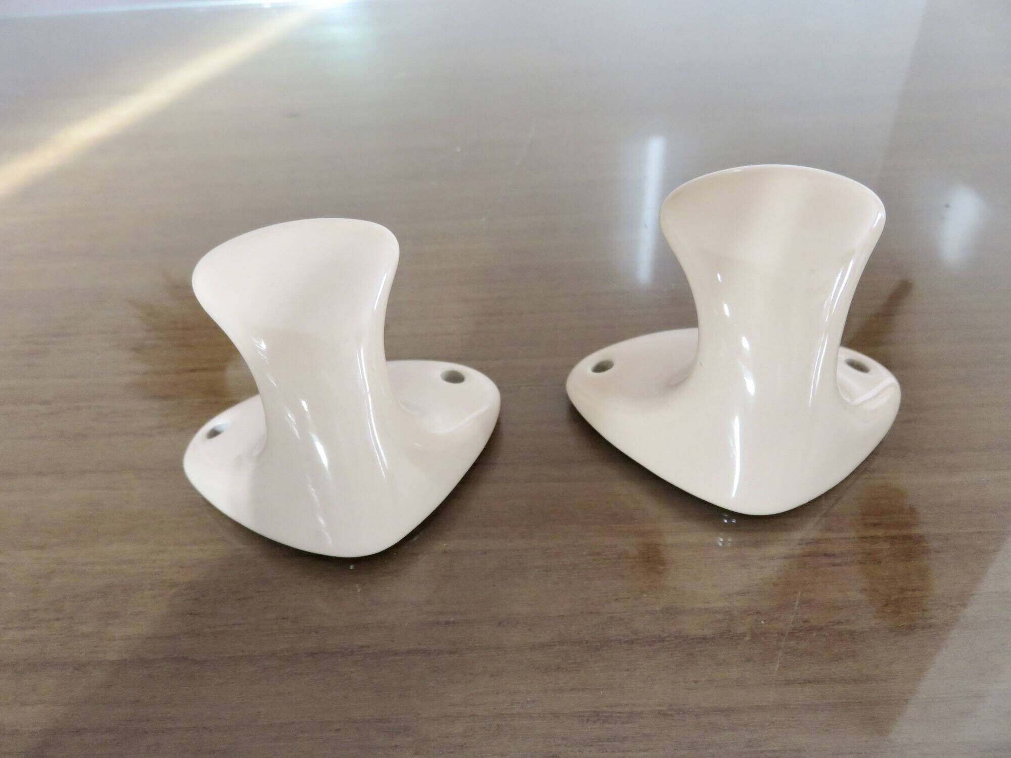 Pair of salmon-colored art deco porcelain hooks from the 30s and 40s