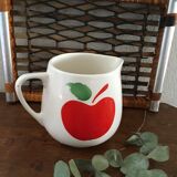 Vintage pitcher with apple decoration.