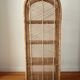 Rattan shelf on legs circa 1960