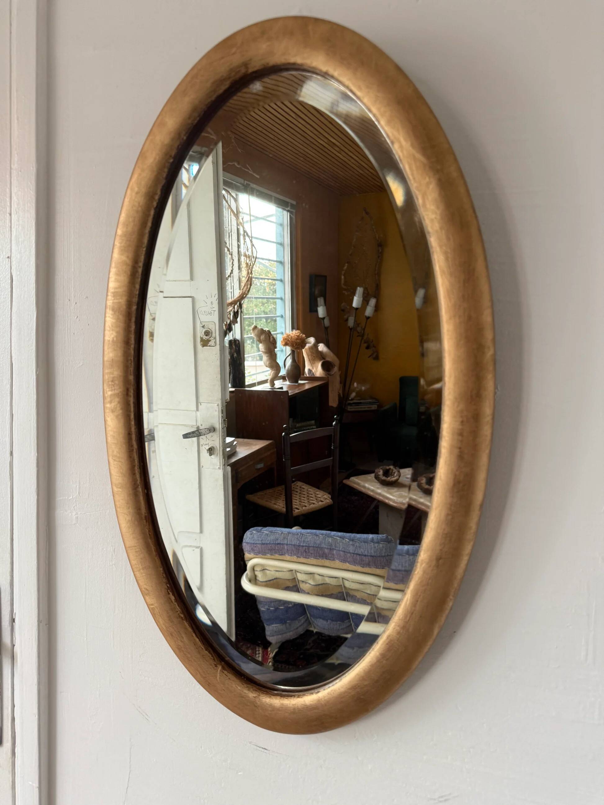 Miroir doré ovale ancien glace biseautée