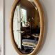 Miroir doré ovale ancien glace biseautée