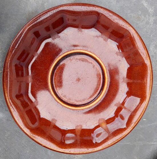 Old cups and under cups of coffee - brown ceramics typical of station buffets