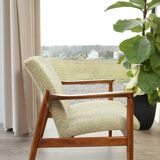 Vintage armchair with a green nebula design by E. Homa, 1970.