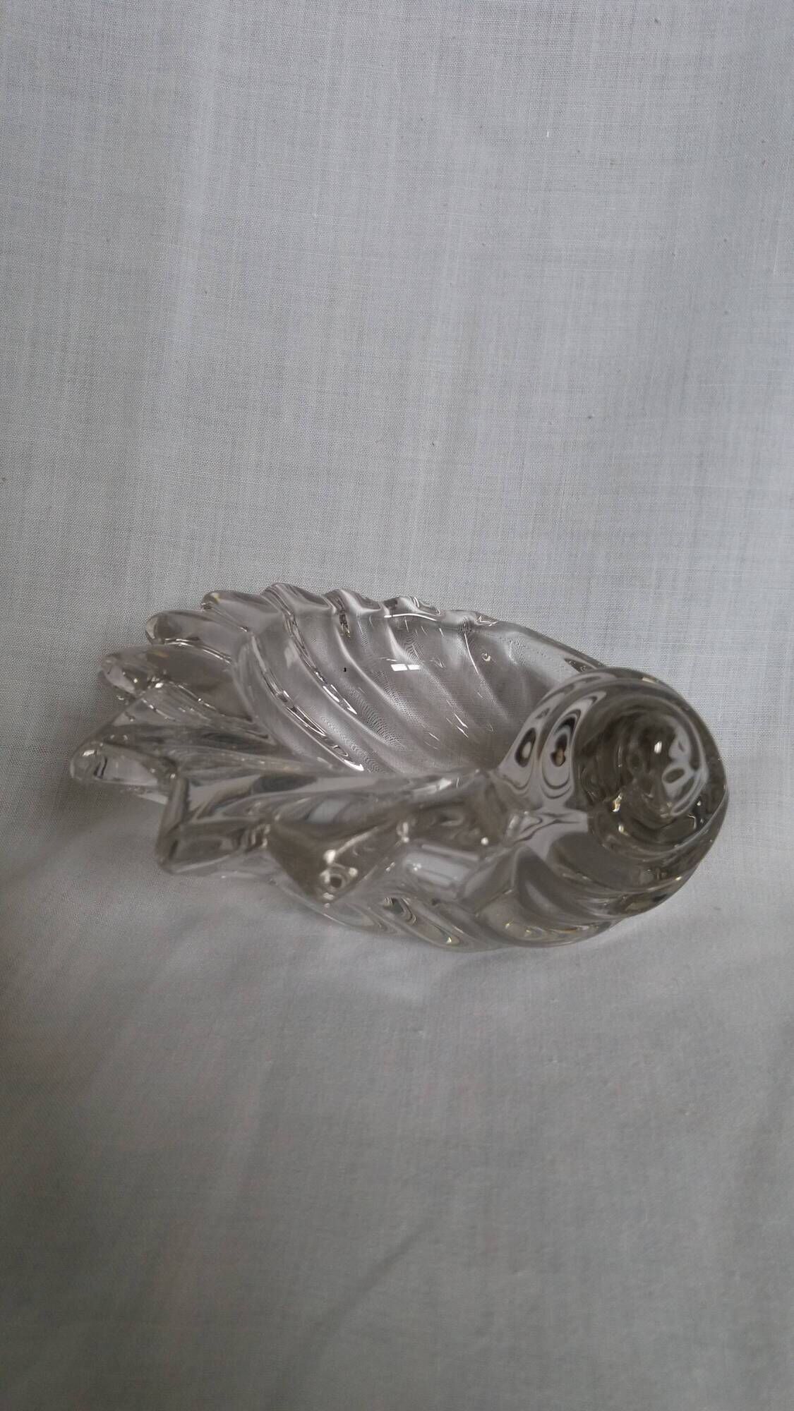 Shell-shaped crystal paperweight.
